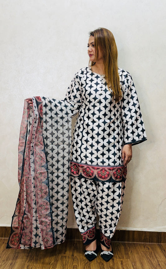 Black and white printed suit set with red bordered dupatta, holding drape – front view, SS-1008