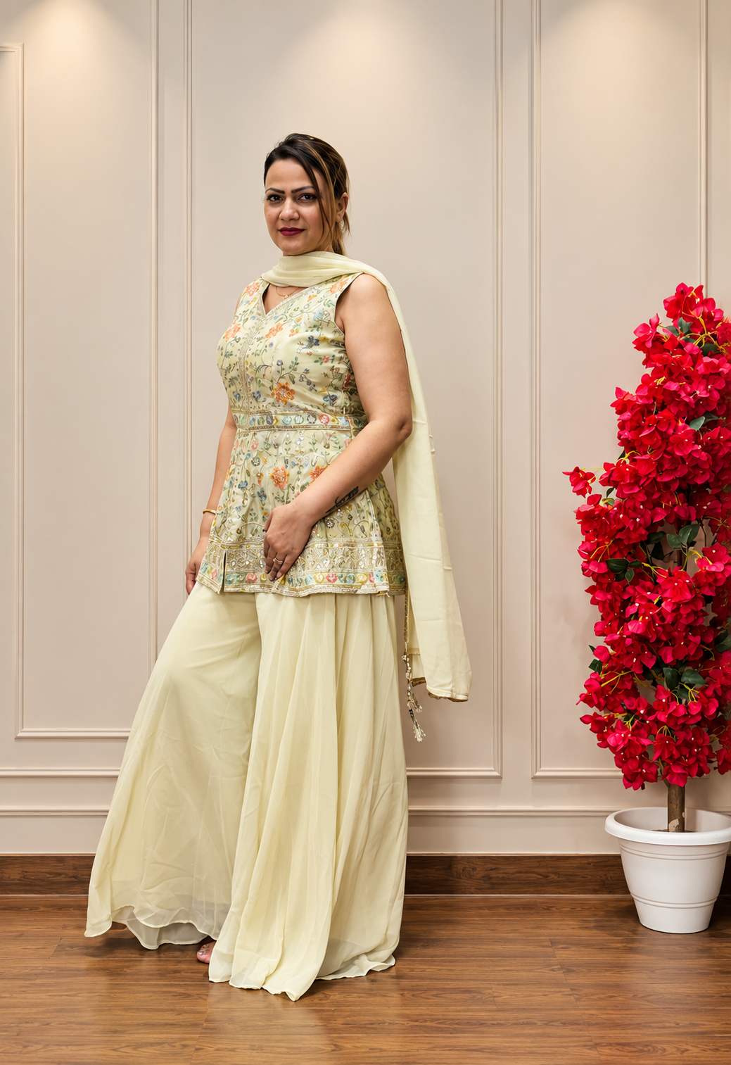 Woman wearing cream floral embroidered palazzo suit set, festive ethnic wear with wide-leg pants, SS-1013