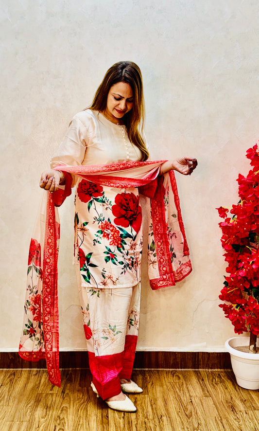 Woman adjusting dupatta on cream satin suit with red rose print and farsi salwar, SS-1006